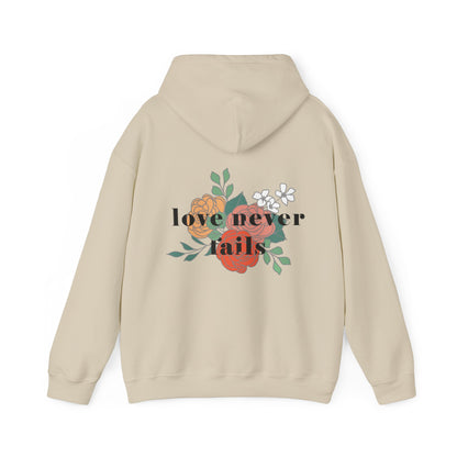 LOVE NEVER FAILS HOODIE